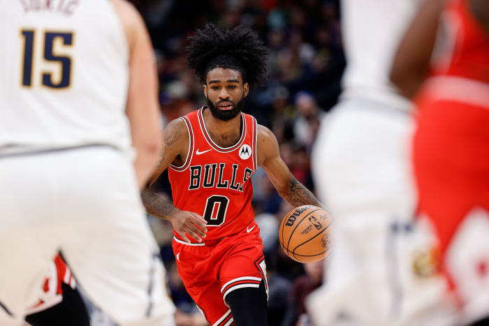 Chicago Bulls guard Coby White (0) dribbles the ball up court in the second quarter against the Denver Nuggets at Ball Arena